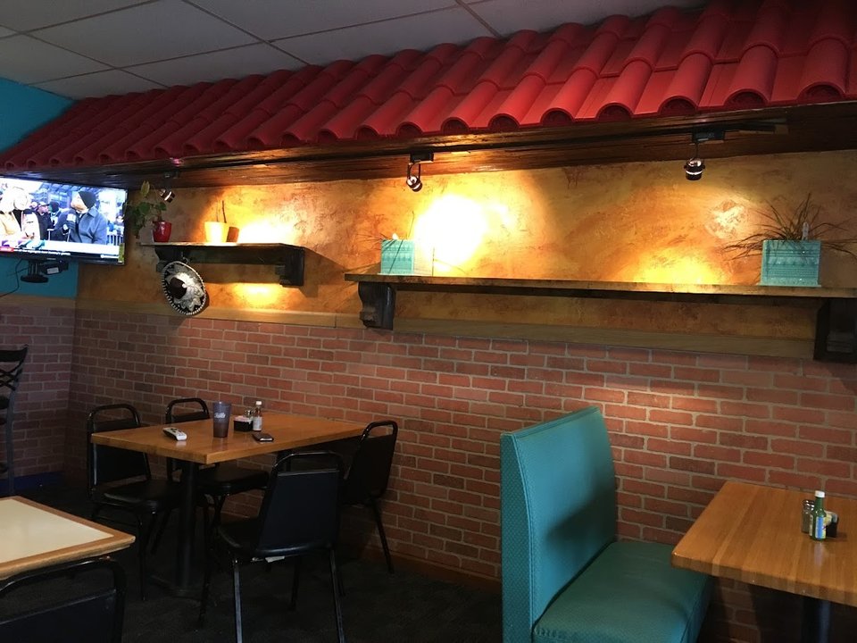 Colorful Mexican restaurant dining room with table settings