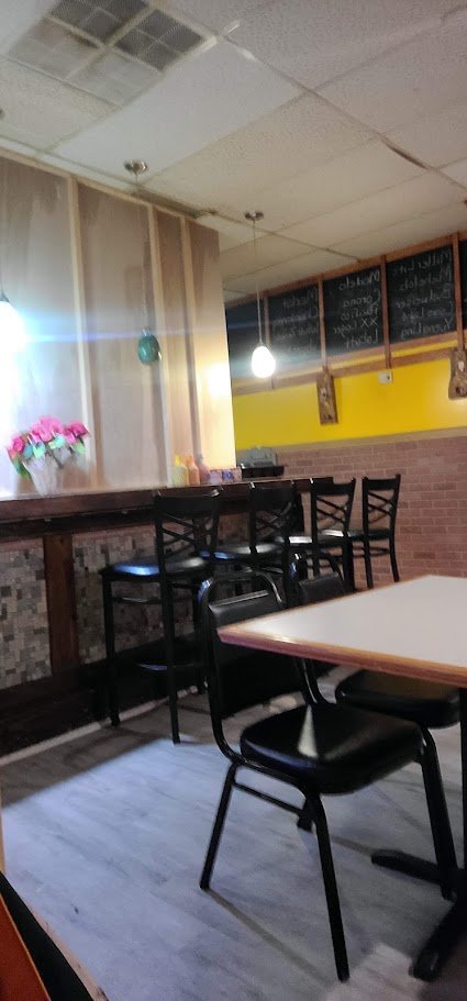 Colorful Mexican restaurant dining room with table settings